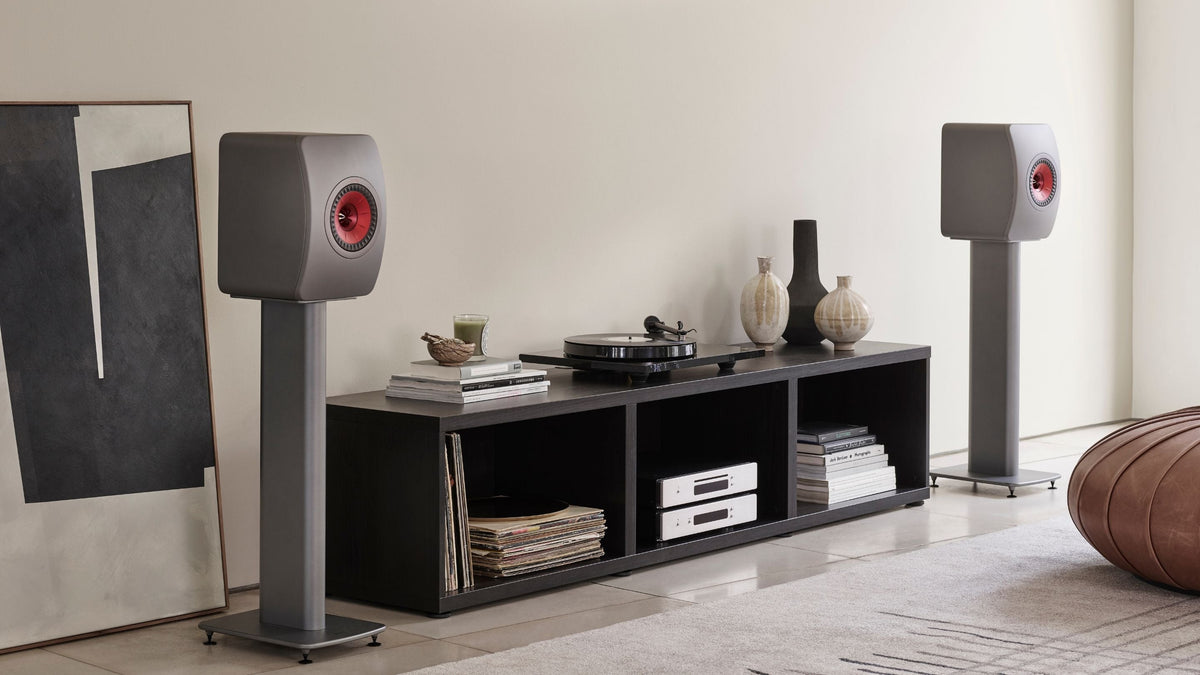 KEF LS50 Meta HiFi speakers mounted to S2 Floor stand placed between low sideboard unit
